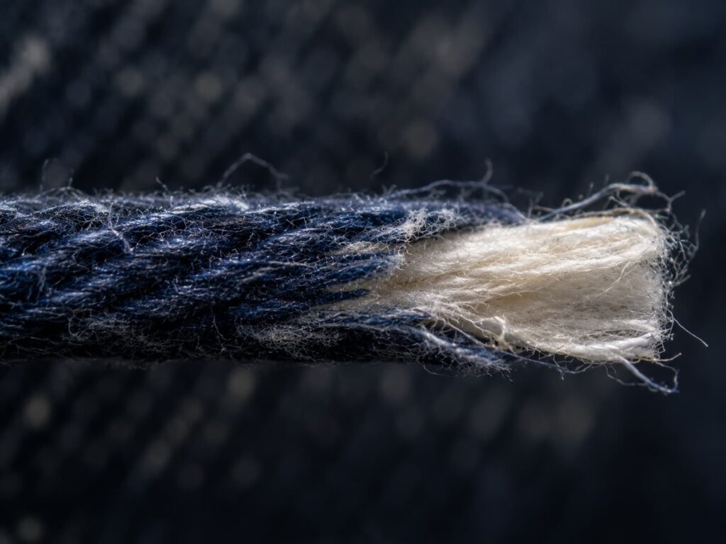 macro view of ring dyed denim yarn with white core
